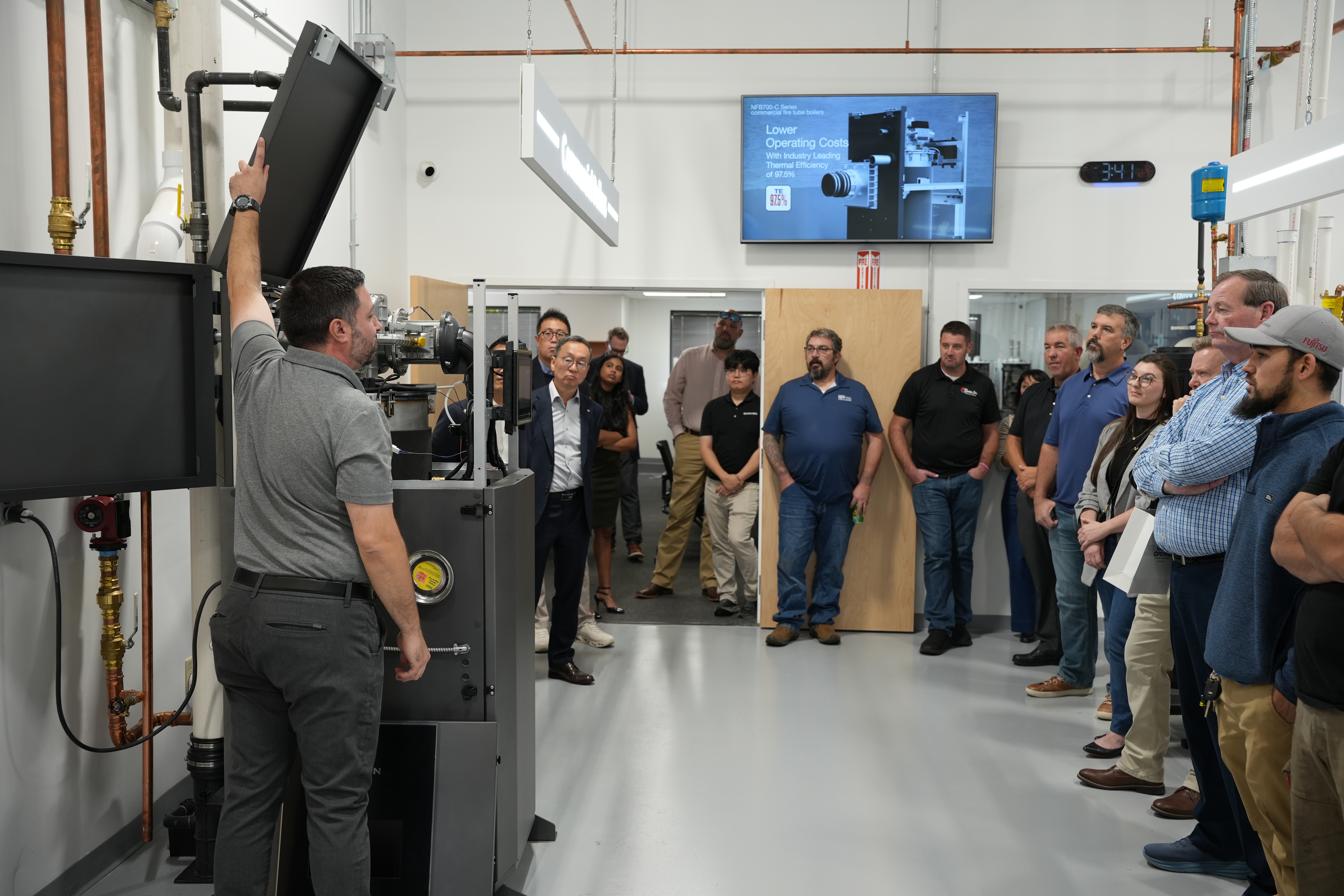 Participants tour the training lab and learn about Navien equipment during a hands-on demonstration